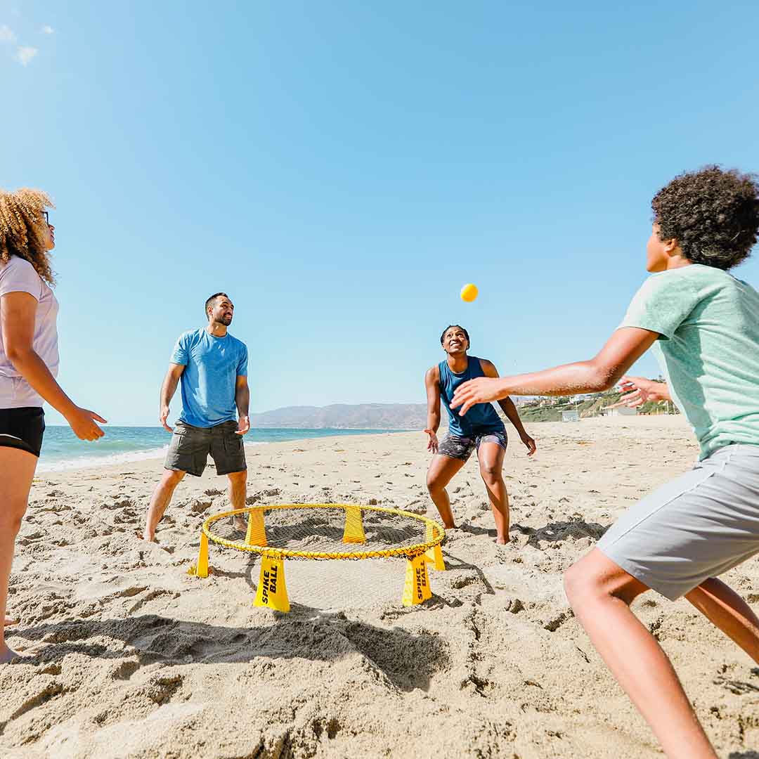 Yellow Spikeball set ideal for playing with friends at the beach.